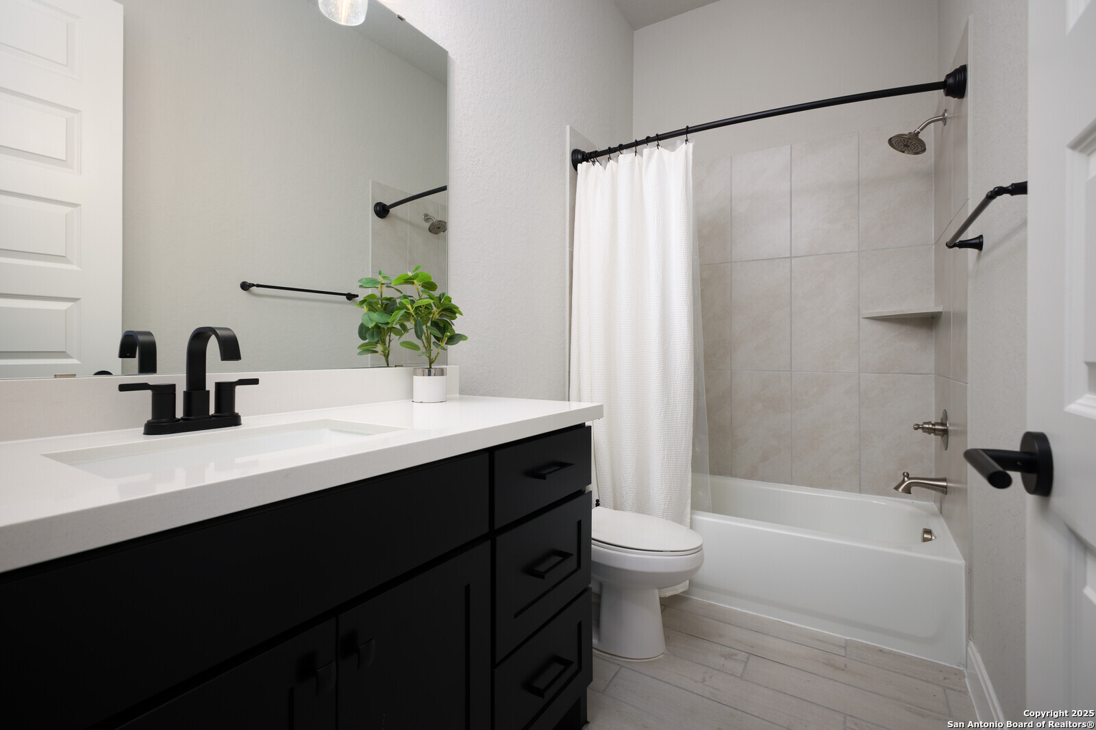 431 Falcon Cove Castroville, TX 78009 - Photo 29 of 46 a bathroom with a sink a toilet and a tub