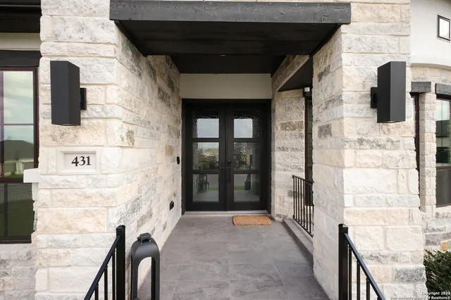 a view of an entryway with wooden floor