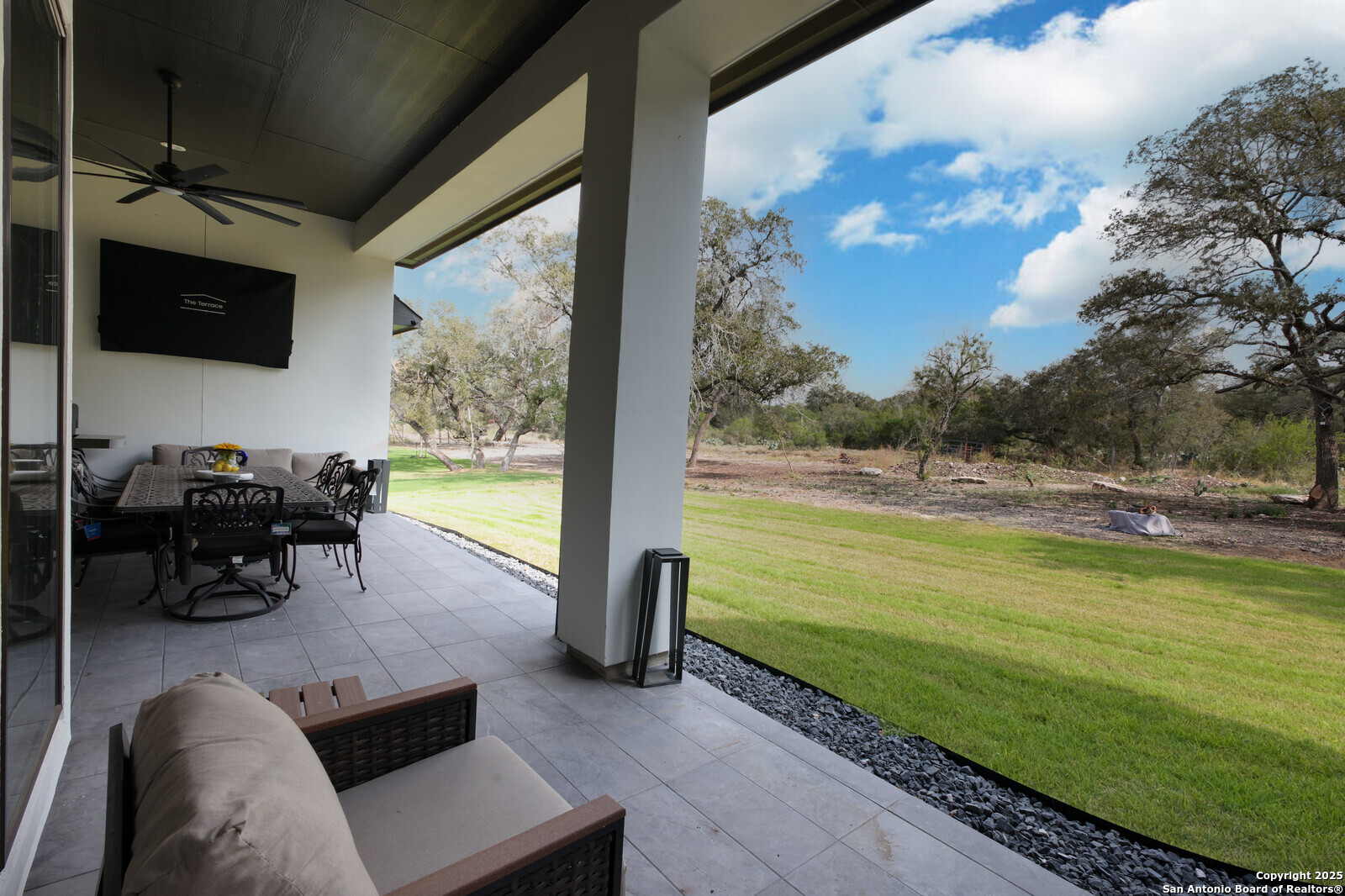 431 Falcon Cove Castroville, TX 78009 - Photo 32 of 46 a view of a swimming pool with lawn chairs and a yard