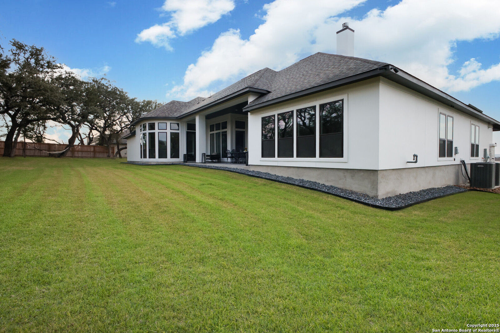 431 Falcon Cove Castroville, TX 78009 - Photo 38 of 46 a view of a house with a yard and sitting area
