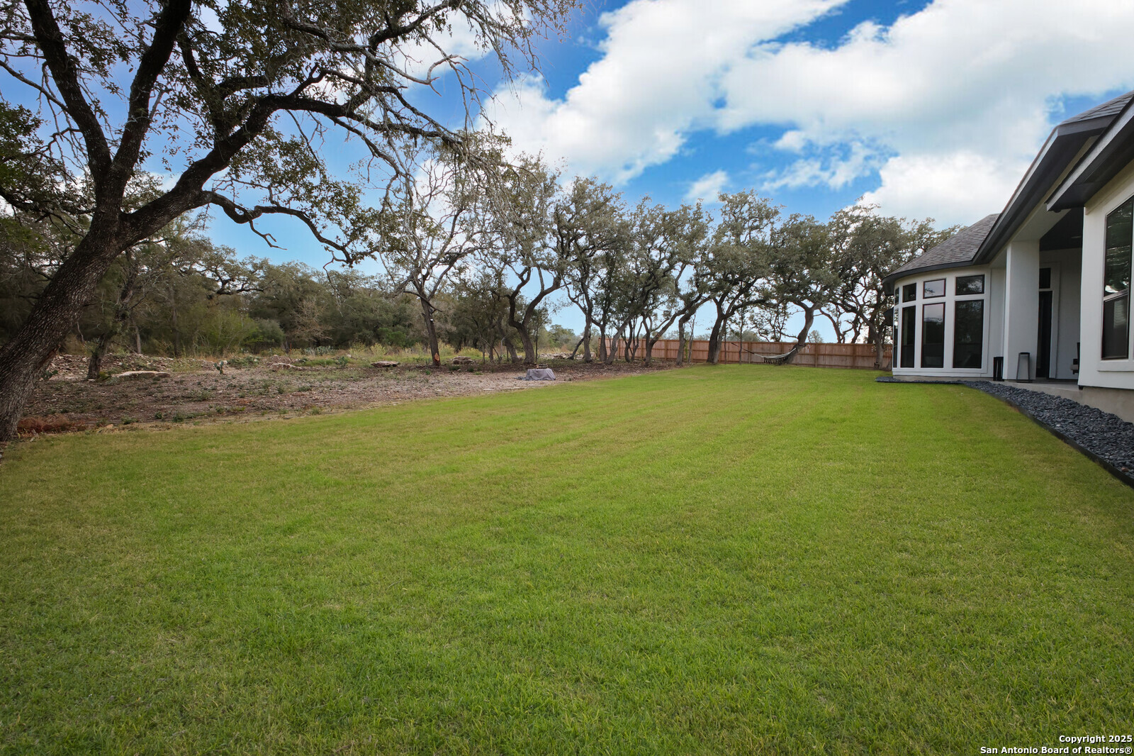 431 Falcon Cove Castroville, TX 78009 - Photo 39 of 46 a view of yard with swimming pool and trees