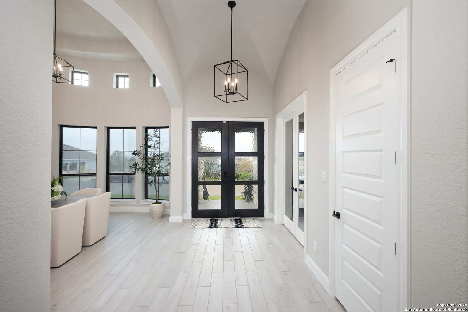 431 Falcon Cove Castroville, TX 78009 - Photo 4 of 46 a view of an entryway with wooden floor