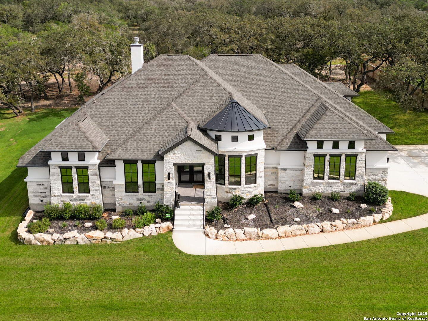 431 Falcon Cove Castroville, TX 78009 - Photo 44 of 46 a front view of a house with a yard table and chairs
