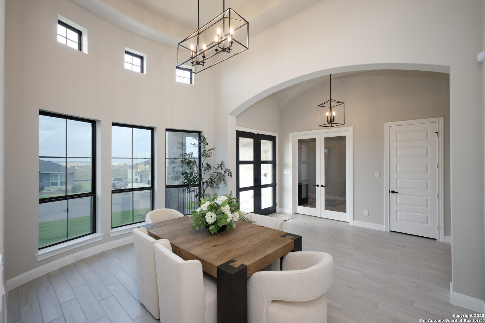 431 Falcon Cove Castroville, TX 78009 - Photo 6 of 46 a dining room with furniture potted plants and wooden floor
