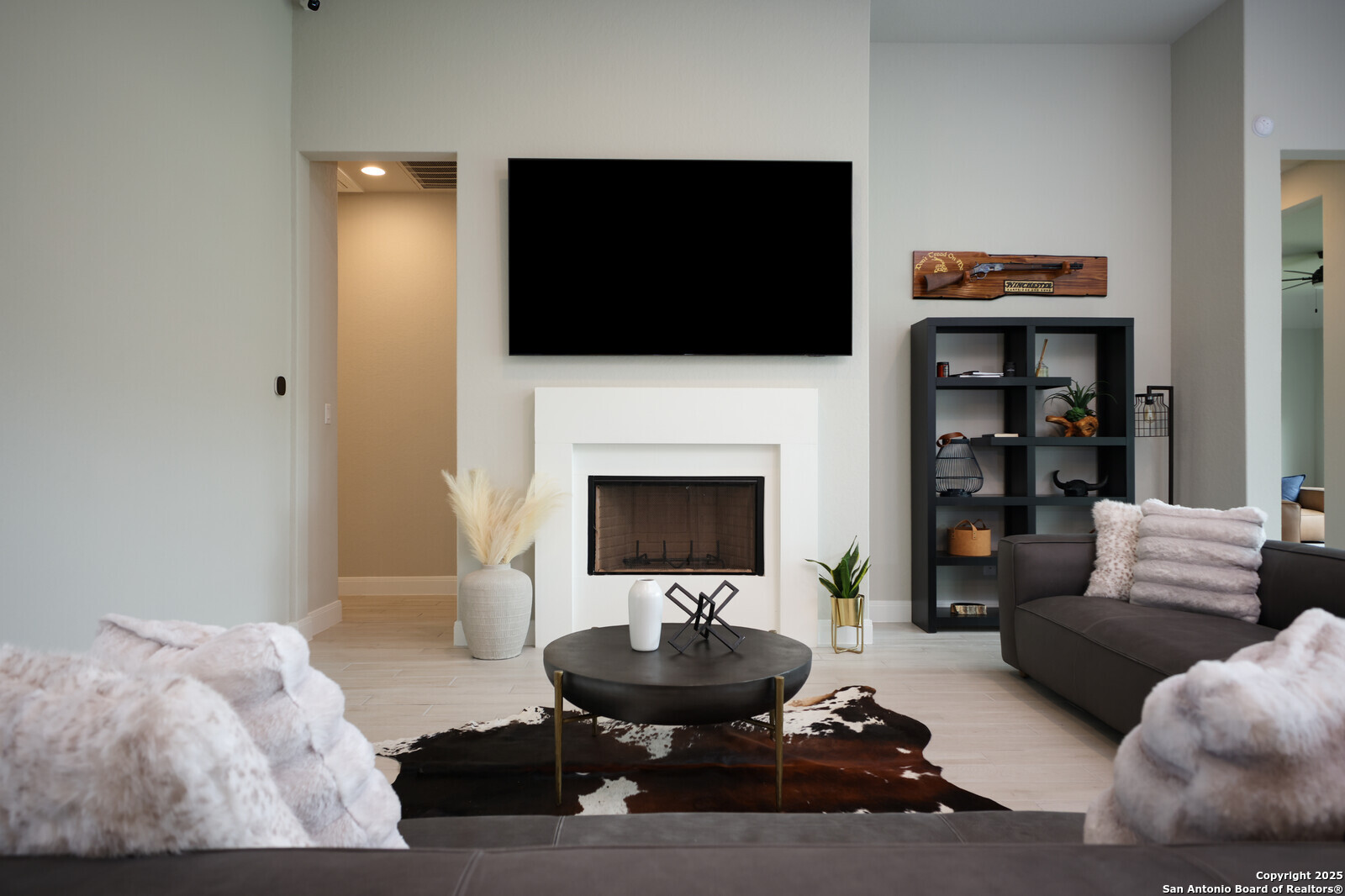 431 Falcon Cove Castroville, TX 78009 - Photo 7 of 46 a living room with furniture and a flat screen tv