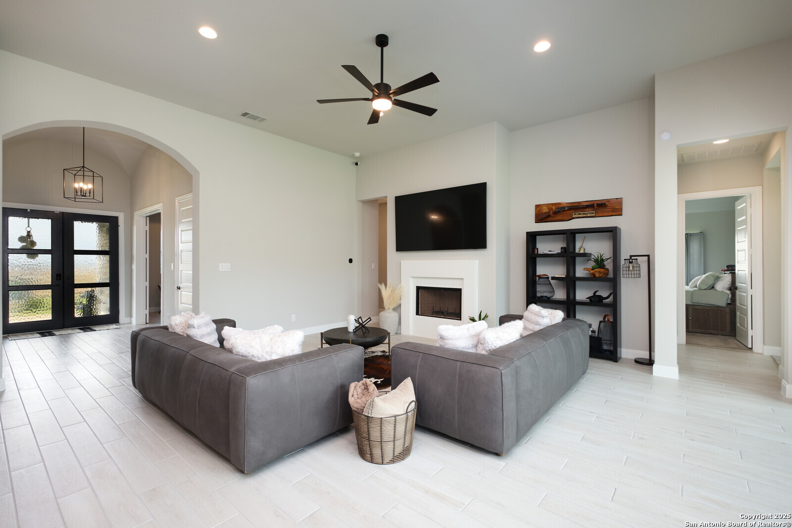 431 Falcon Cove Castroville, TX 78009 - Photo 9 of 46 a living room with furniture and a flat screen tv