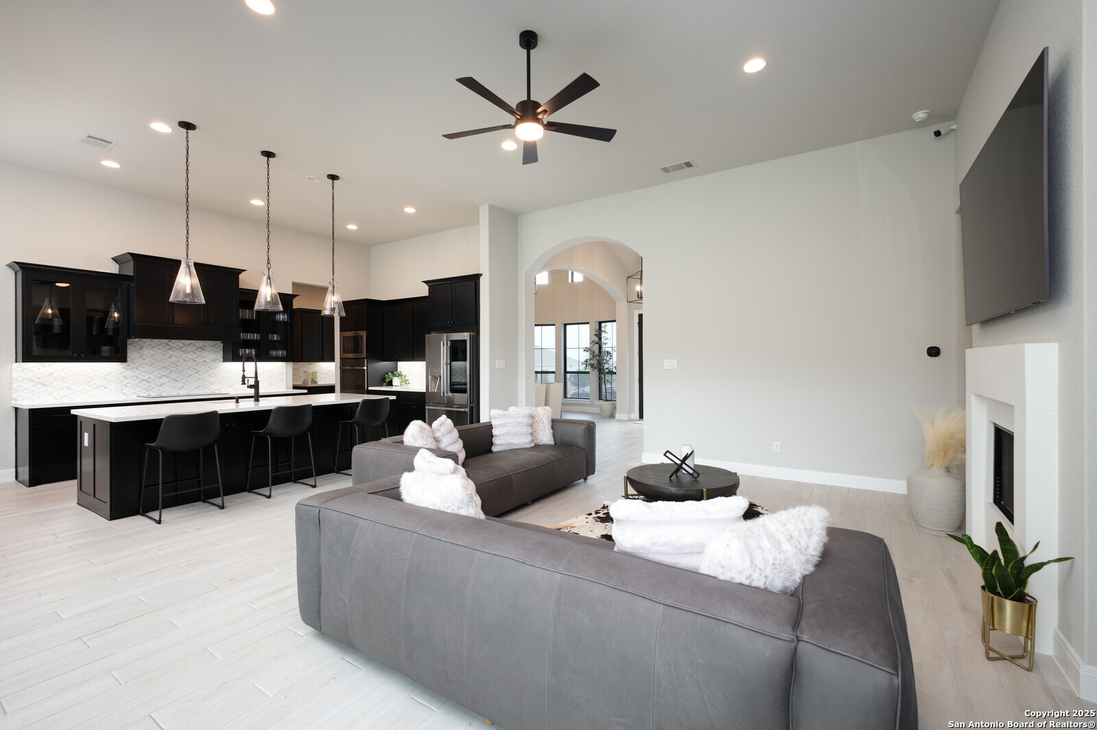 431 Falcon Cove Castroville, TX 78009 - Photo 10 of 46 a living room with stainless steel appliances kitchen island furniture and a flat screen tv