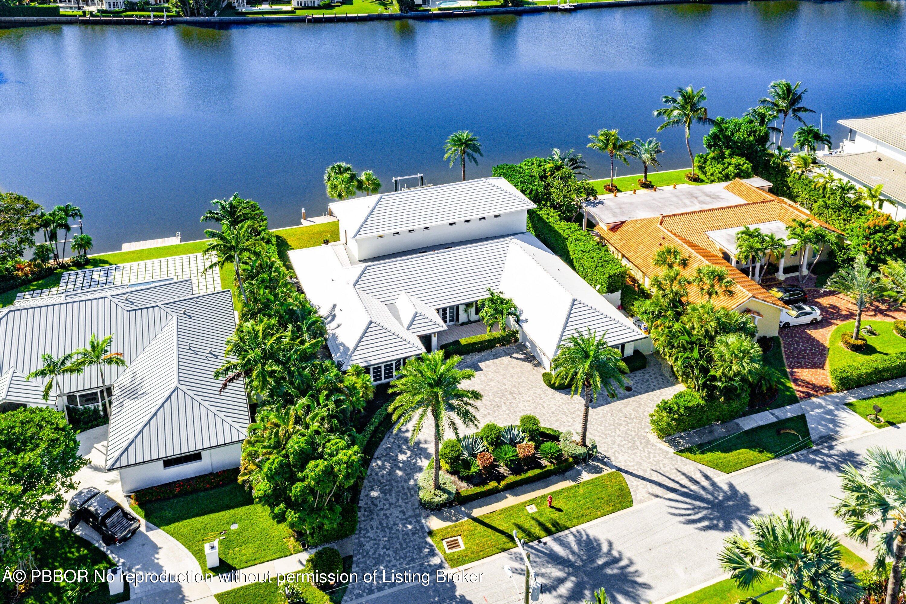 50 Spoonbill Road Lantana, FL 33462 - Photo 1 of 37 an aerial view of a house with a yard basket ball court and outdoor seating