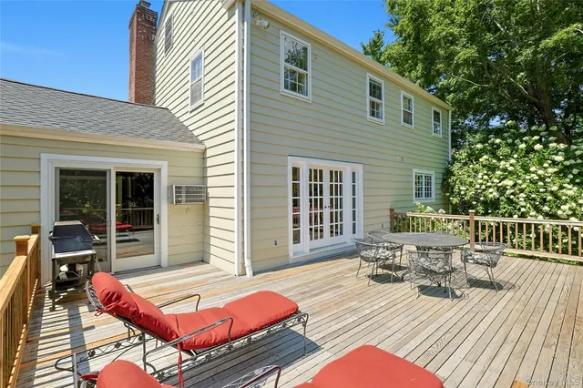 a view of a patio with couple of chairs