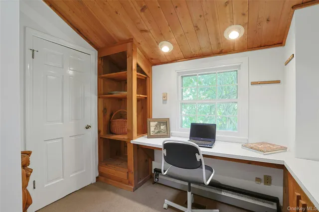 a workspace with furniture and window