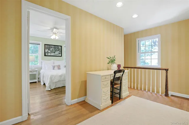 a spacious bedroom with a bed and a window