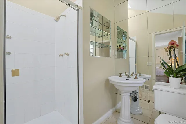 a bedroom with furniture and a flat screen tv