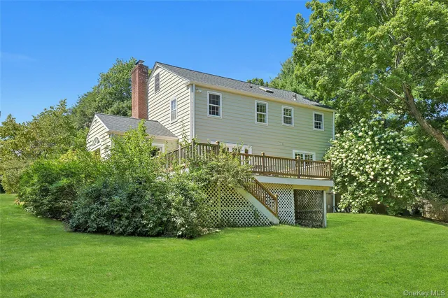a view of a grassy field with trees