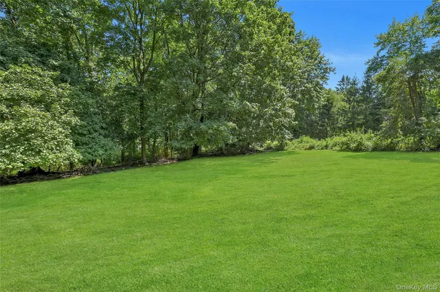 an aerial view of a house with pool yard outdoor seating and yard