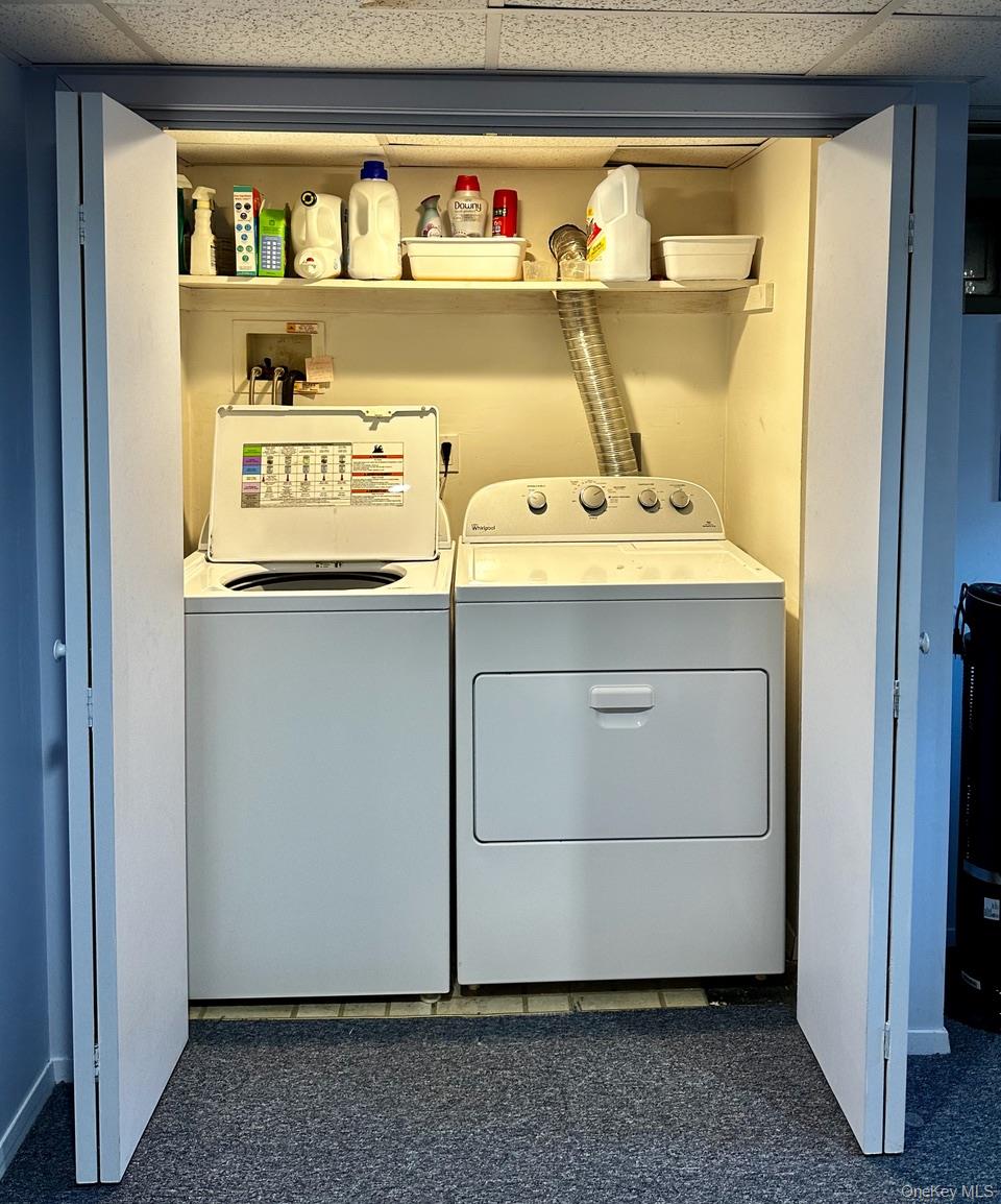26 Canterbury Road Woodbury, NY 11797 - Photo 12 of 17 a utility room with washer and dryer