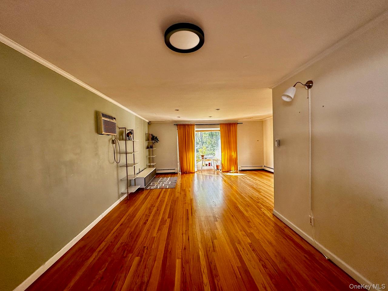 26 Canterbury Road Woodbury, NY 11797 - Photo 4 of 17 a view of a room with wooden floor