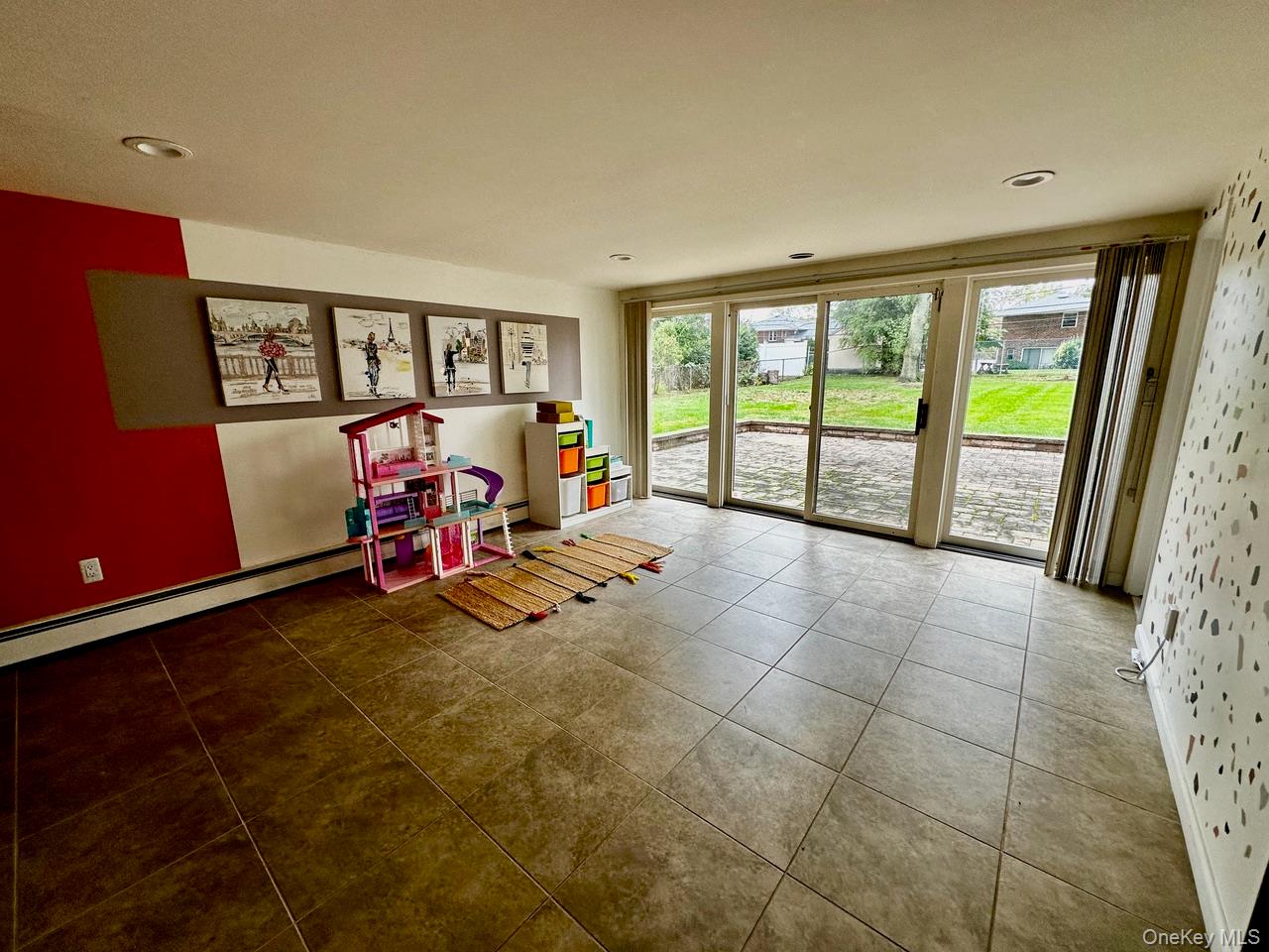 26 Canterbury Road Woodbury, NY 11797 - Photo 9 of 17 a view of a livingroom with furniture and air hockey table
