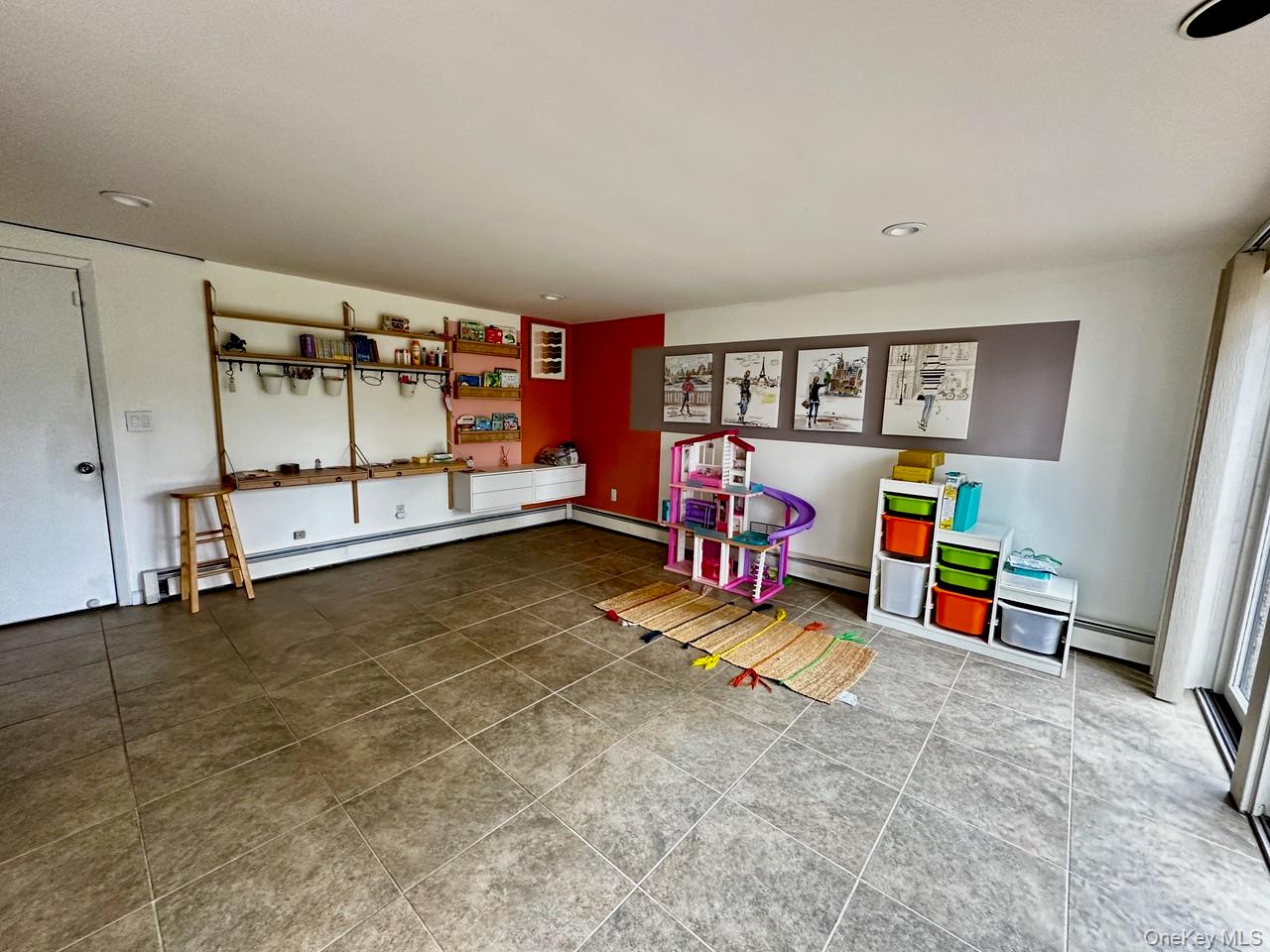 26 Canterbury Road Woodbury, NY 11797 - Photo 10 of 17 a view of an empty room with toys and hardwood floor