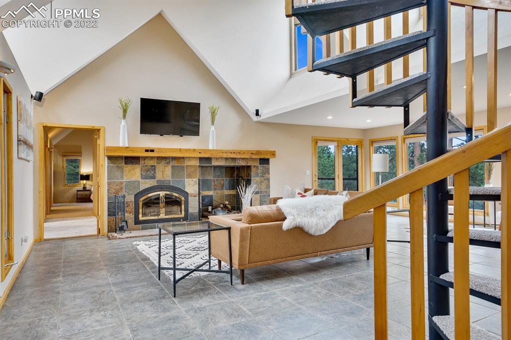6900 Highway 24 Divide, CO 80814 - Photo 17 of 50 a living room with furniture and a fireplace