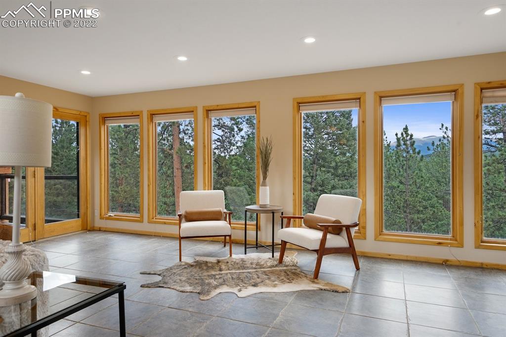6900 Highway 24 Divide, CO 80814 - Photo 19 of 50 a living room with furniture and large windows