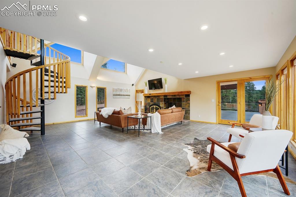 6900 Highway 24 Divide, CO 80814 - Photo 20 of 50 a living room with furniture and a fireplace