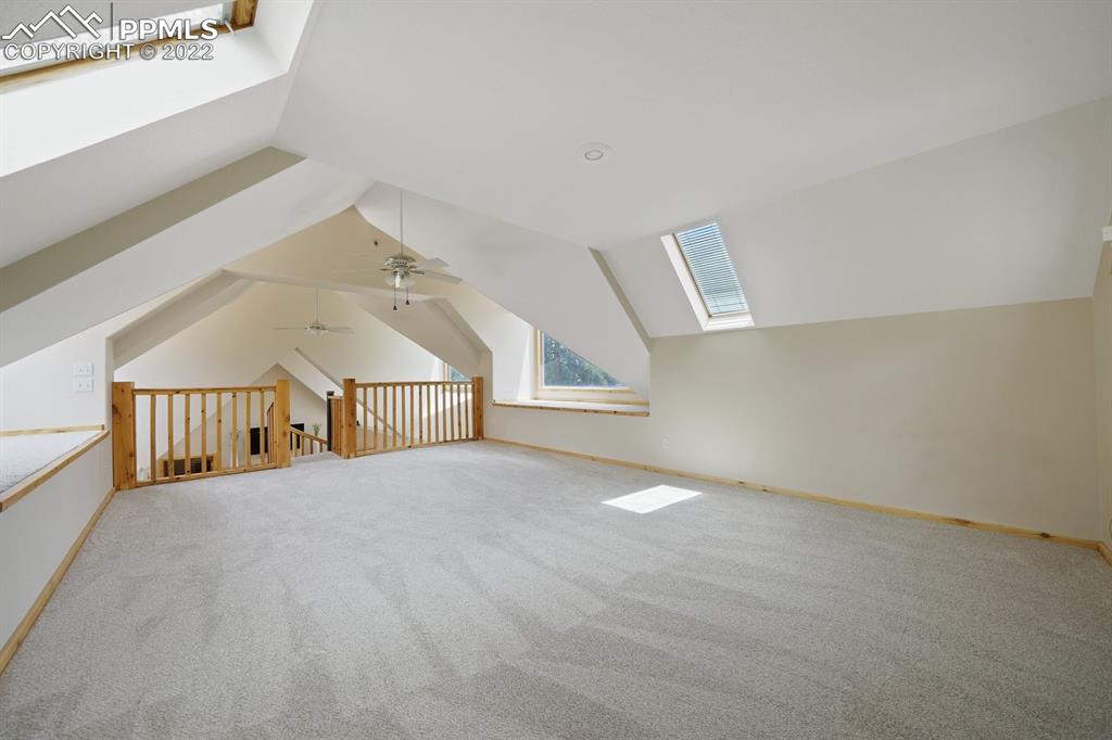 6900 Highway 24 Divide, CO 80814 - Photo 23 of 50 an empty room with windows and stairs