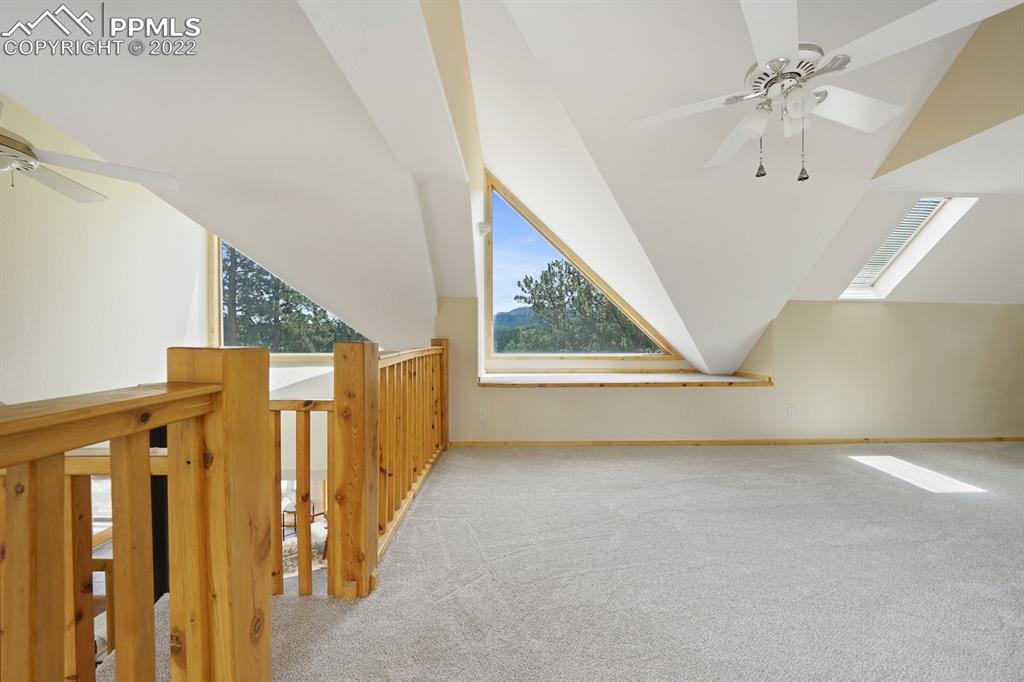6900 Highway 24 Divide, CO 80814 - Photo 24 of 50 a view of a livingroom with wooden floor and a ceiling fan