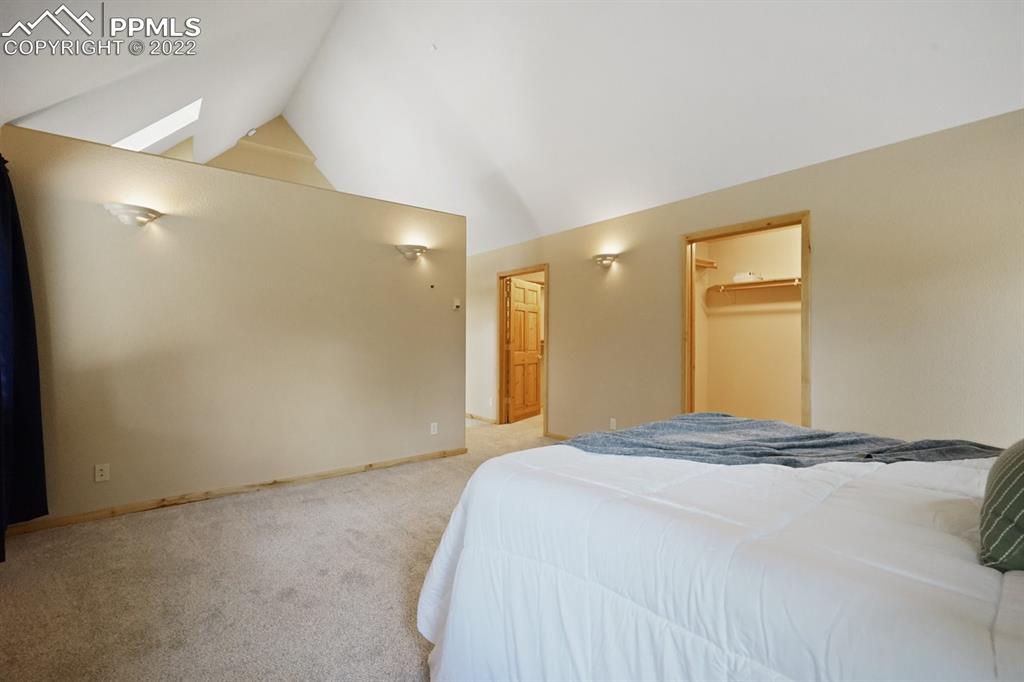 6900 Highway 24 Divide, CO 80814 - Photo 27 of 50 a bedroom with a bed and a painting on the wall