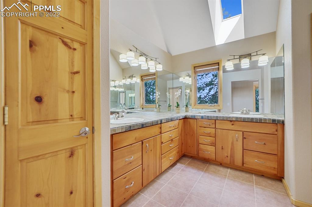 6900 Highway 24 Divide, CO 80814 - Photo 28 of 50 a bathroom with a granite countertop sink mirror and a