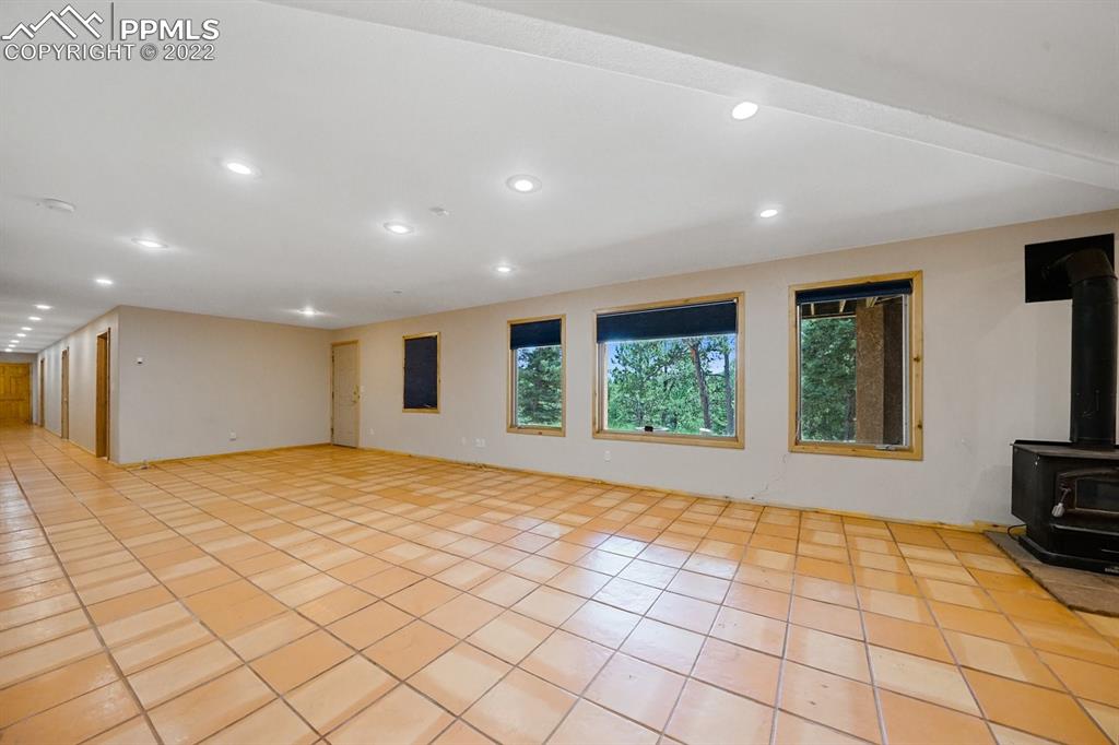6900 Highway 24 Divide, CO 80814 - Photo 33 of 50 a view of an empty room with a fireplace and a window