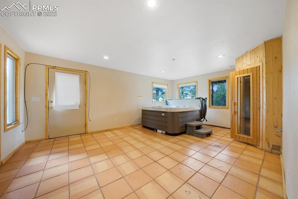 6900 Highway 24 Divide, CO 80814 - Photo 42 of 50 a living room with a large mirror and glass door