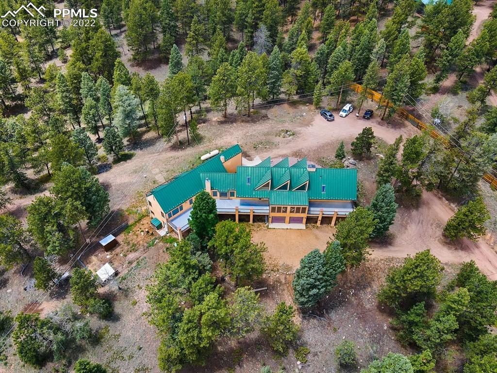 6900 Highway 24 Divide, CO 80814 - Photo 44 of 50 an aerial view of a house with a yard and lake view