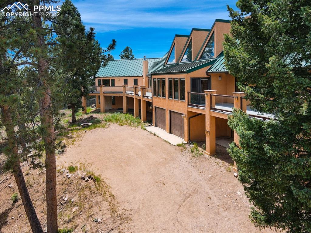 6900 Highway 24 Divide, CO 80814 - Photo 45 of 50 a front view of a house with a yard
