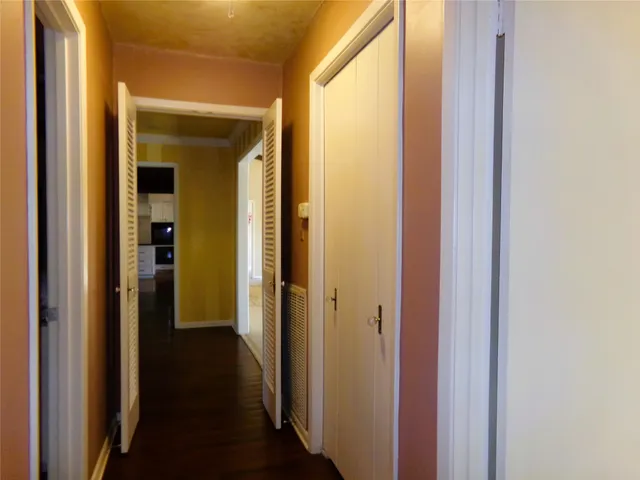 a view of a bathroom from a hallway