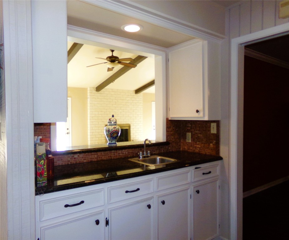605 South Summit Street Weimar, TX 78962 - Photo 5 of 24 a sink with granite countertop a sink and a window