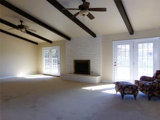 a living room with furniture window and fireplace