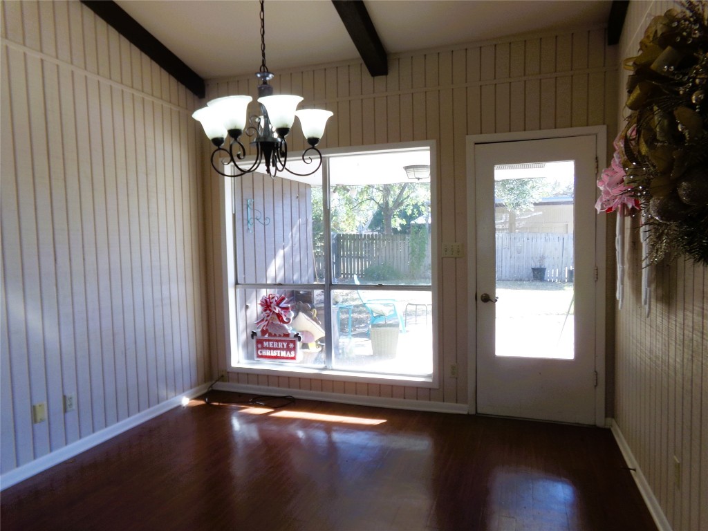 605 South Summit Street Weimar, TX 78962 - Photo 8 of 24 a view of a chandelier fan and wooden floor