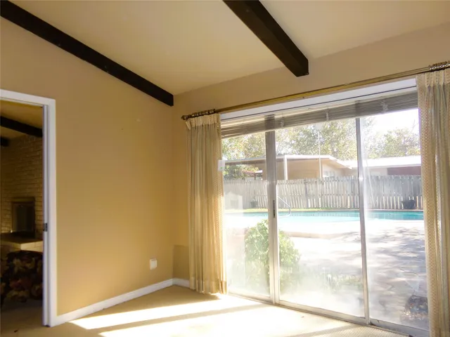 a view of a room with a large window