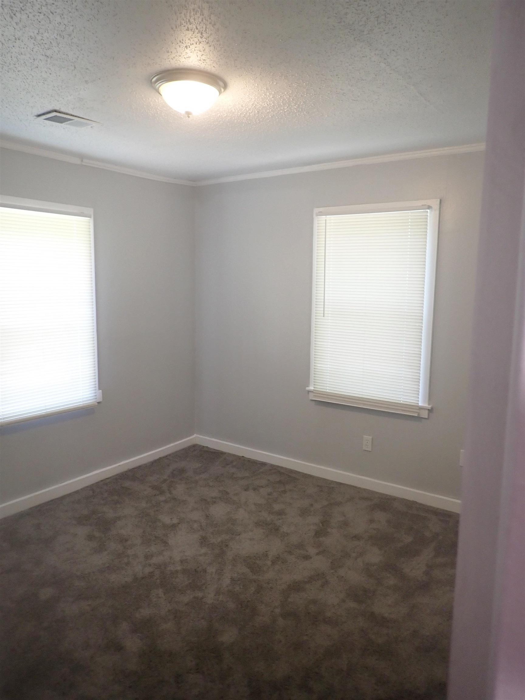2633 Walnut Road Memphis, TN 38128 - Photo 3 of 6 an empty room with a window