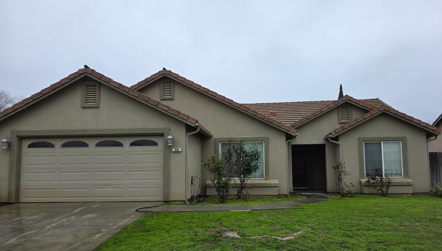 804 Morris Lane Madera, CA 93637 - Photo 1 of 17 a front view of a house with a yard