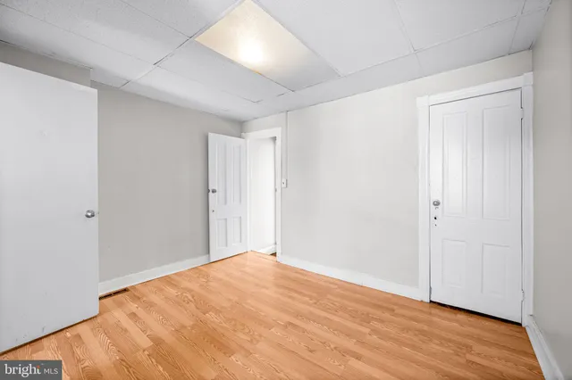 a bathroom with a sink a toilet and a window