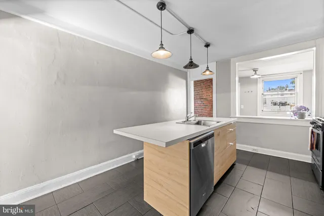 a kitchen with a stove and a sink