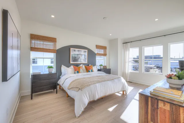 a bedroom with a bed and a table