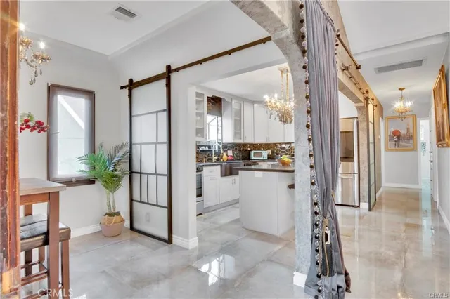 a bathroom with a granite countertop sink a toilet and shower
