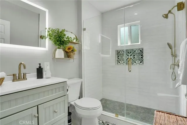 a bedroom with a bed and large windows