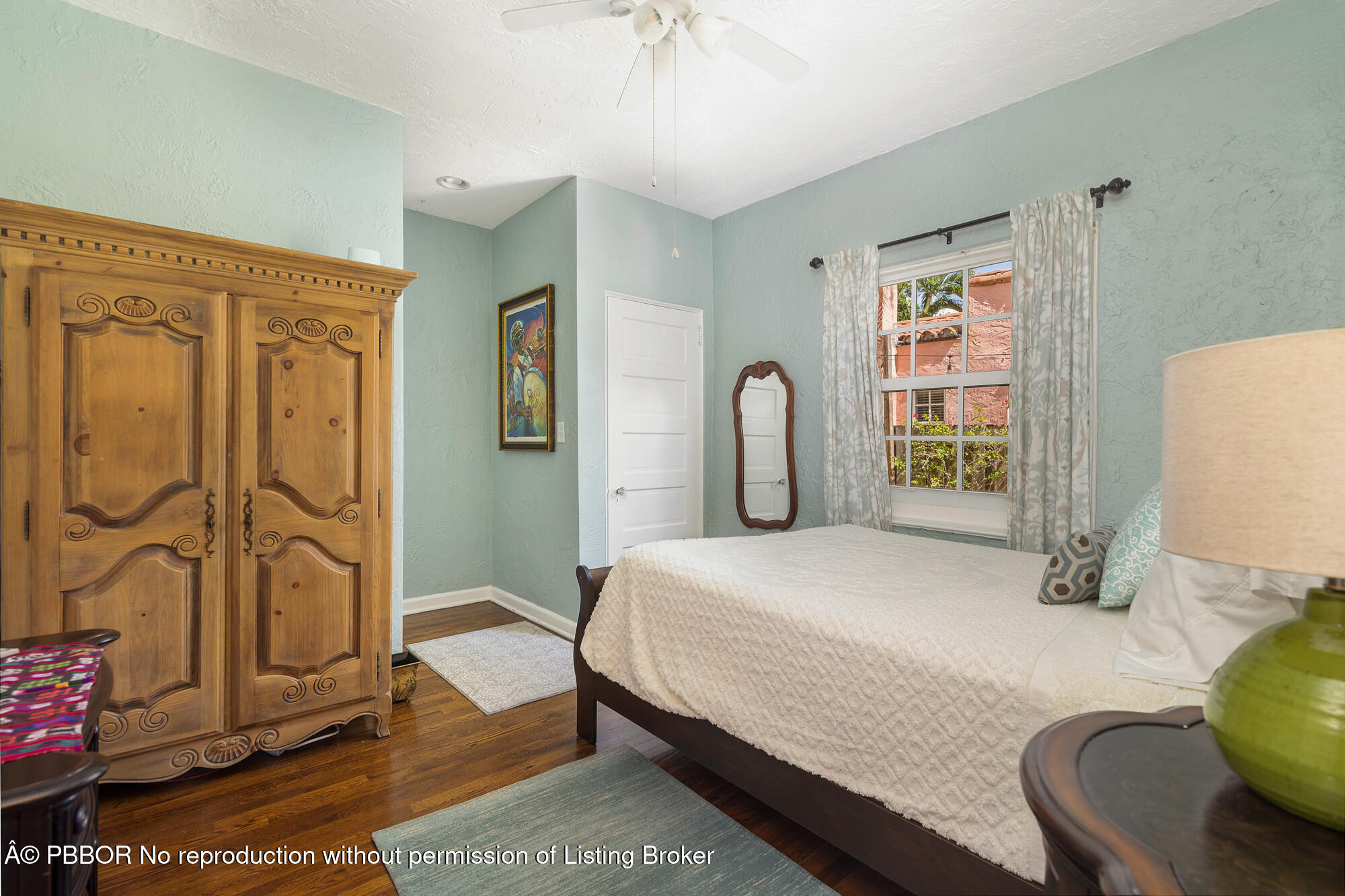 714 Sunset Road West Palm Beach, FL 33401 - Photo 12 of 18 a bedroom with a bed dresser and a window