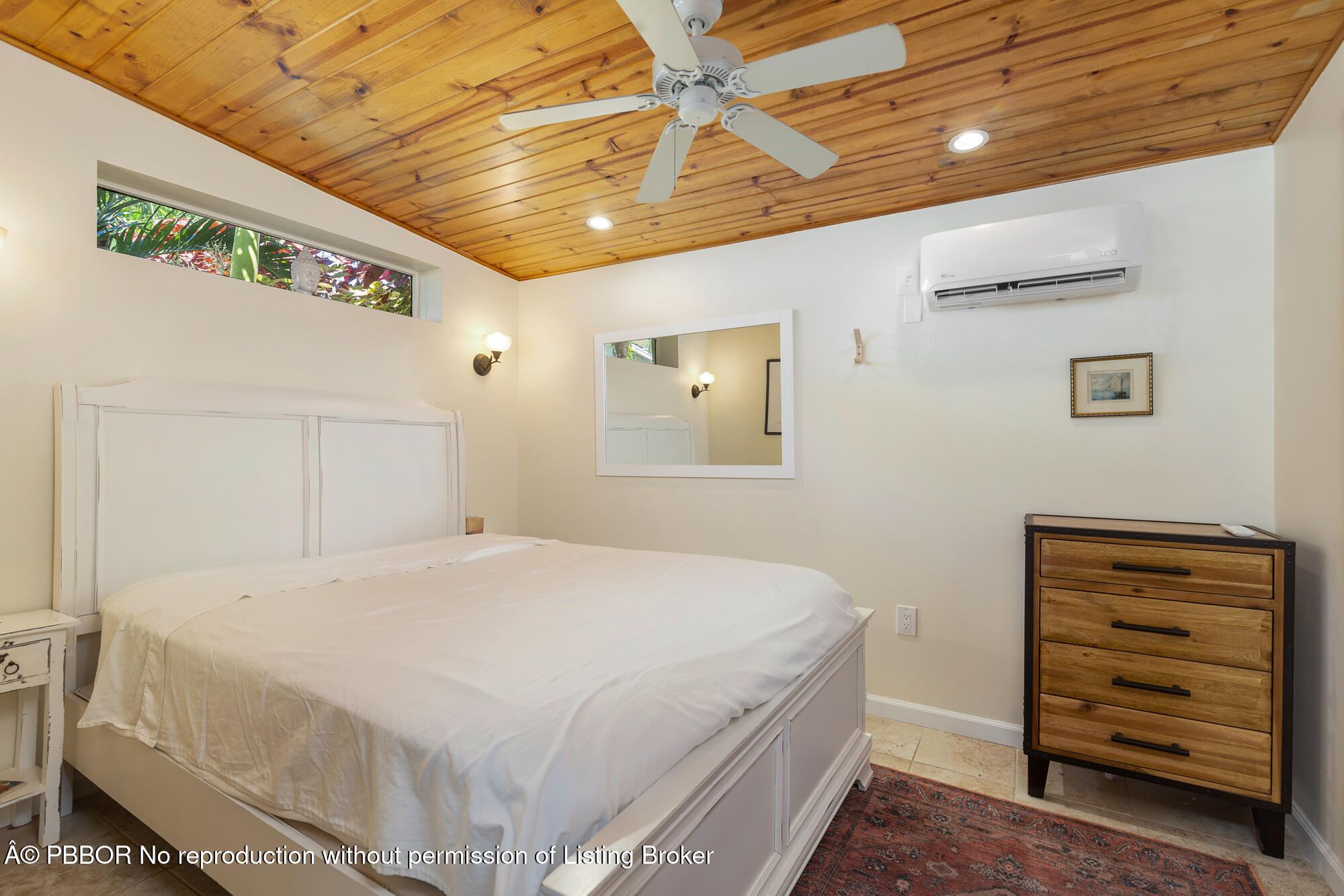714 Sunset Road West Palm Beach, FL 33401 - Photo 15 of 18 a bedroom with a bed and a dresser
