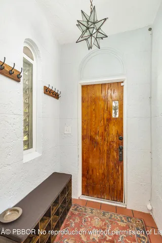 a view of room with window and a ceiling fan
