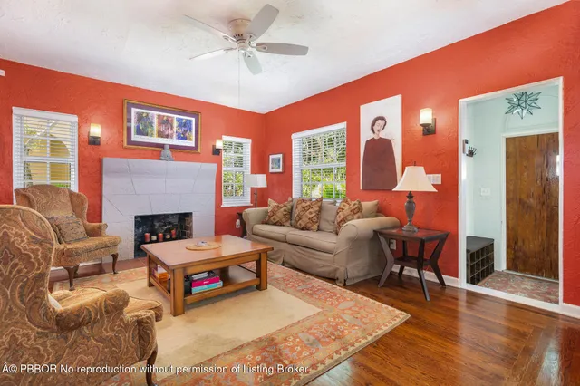 a living room with furniture and a fireplace