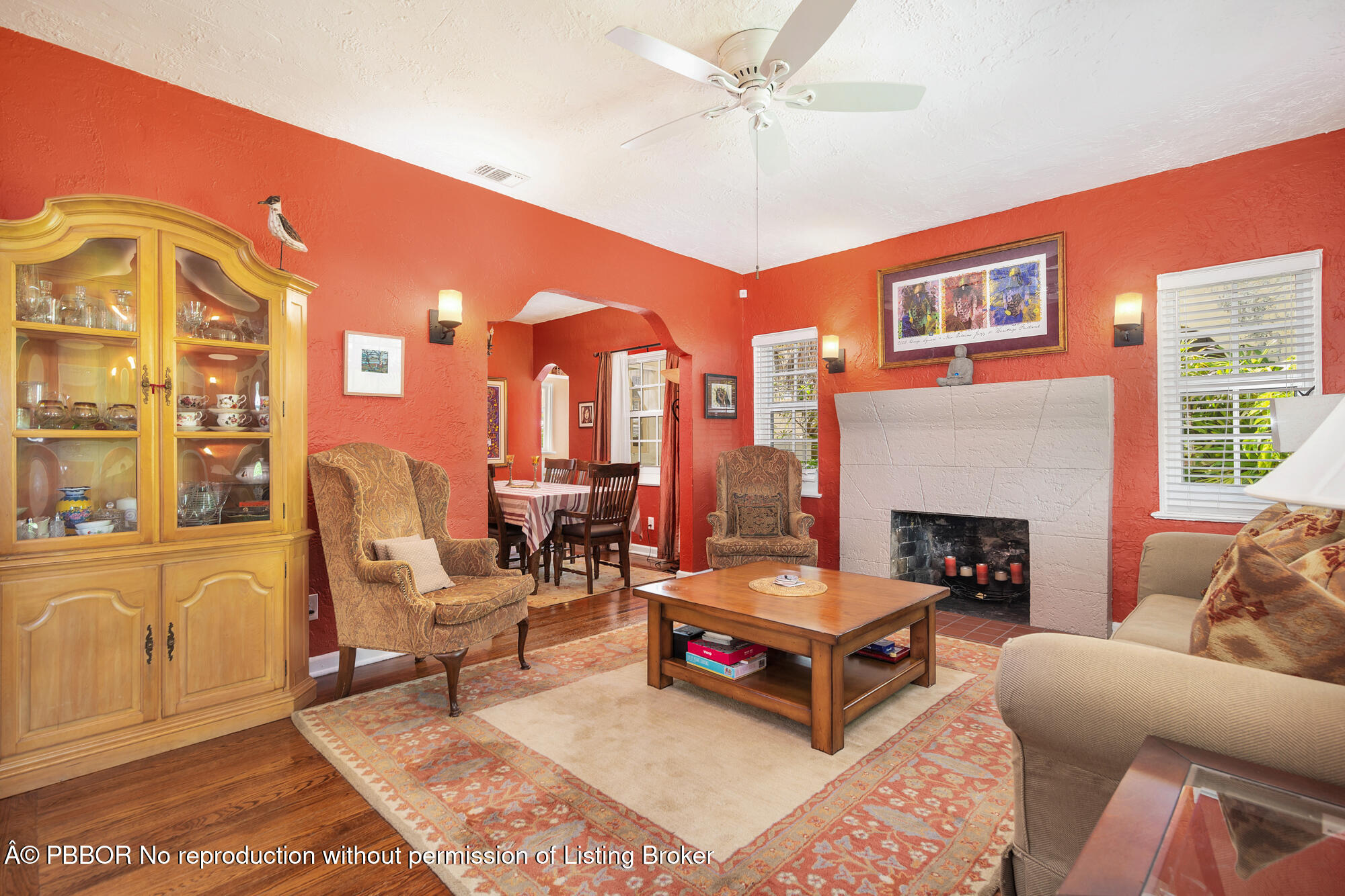 714 Sunset Road West Palm Beach, FL 33401 - Photo 5 of 18 a living room with furniture a fireplace and a large window